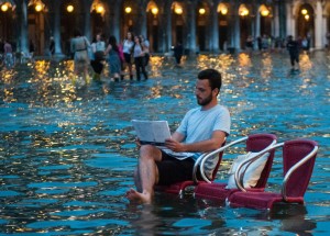 Alamy Live News. G421XT Venice, Italy. 16th June, 2016. VENICE, ITALY - June 15: A man draws during the high water on June 15, 2016 in Venice, Italy. The high water in this period is exceptional, and it is a surprise for citizen and tourists. HOW TO LICENCE THIS PICTURE: please contact us via e-mail at sales@xianpix.com or call 44 (0)207 1939846 for prices and terms of copyright. First Use Only, Editorial Use Only, All repros payable, No Archiving. © Awakening/Xianpix © Simone Padovani /Awakening/Alamy Live News This is an Alamy Live News image and may not be part of your current Alamy deal . If you are unsure, please contact our sales team to check.